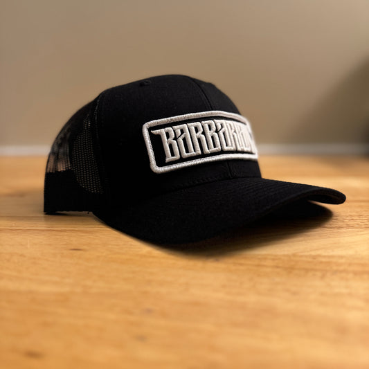 Yupoong Trucker Hat [Black] – White/Black Embroidered Patch