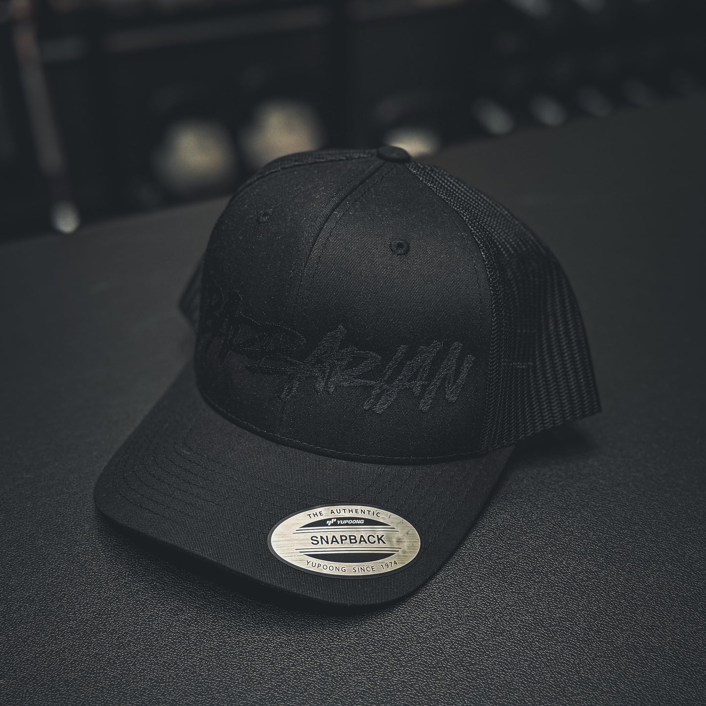 STRIFE Trucker Hat [Yupoong] – Blackout